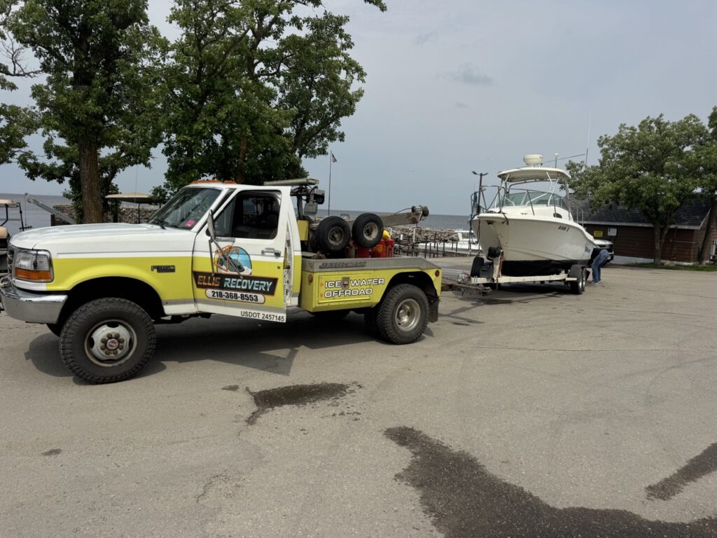 Sunken boat recovery operation on Lake of the Woods in northern Minnesota